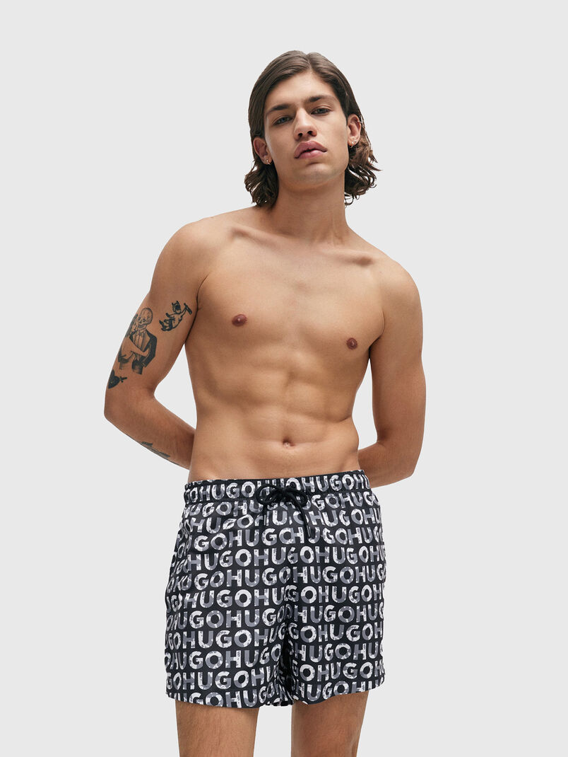 TORTUGA beach shorts with a monogram print - 3