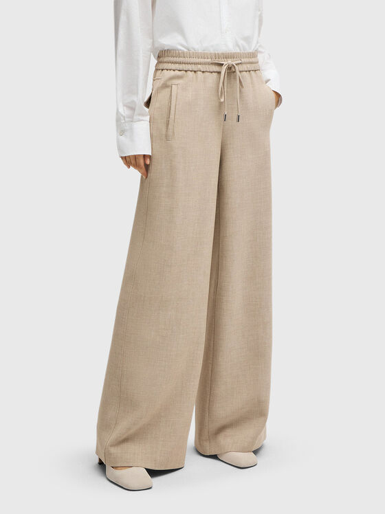Beige trousers ties at the waist - 1