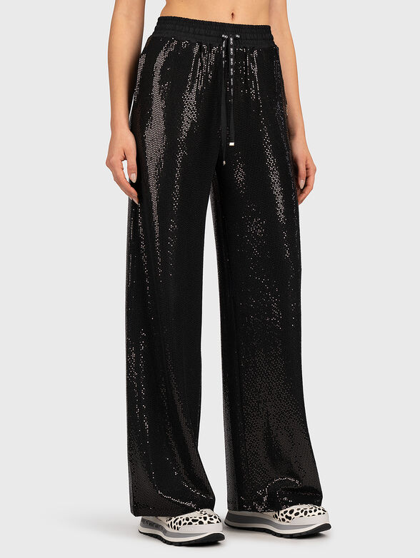 Trousers with appliquéd shiny details - 1