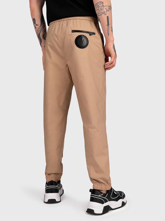 Beige trousers with logo patch - 2