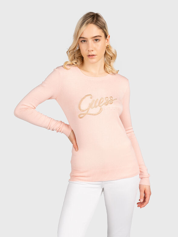 Pink sweater with gold-colored logo element - 1