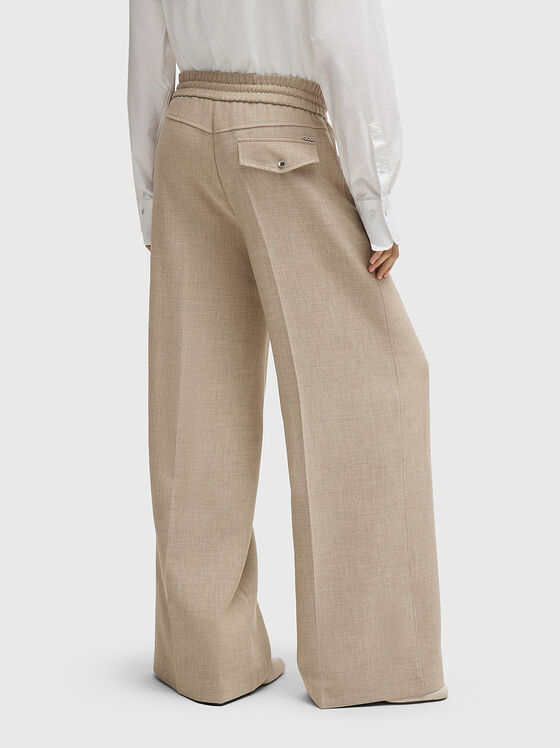 Beige trousers ties at the waist - 2
