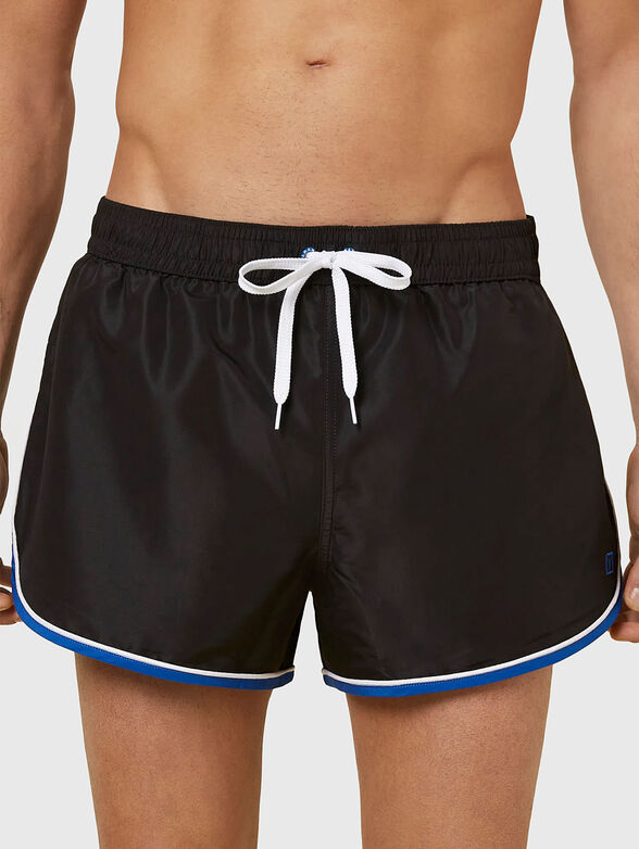 PASSEPARTOUT beach shorts in black - 1