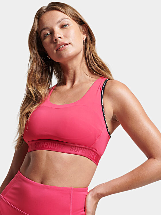 Pink sports bra with logo accents - 1