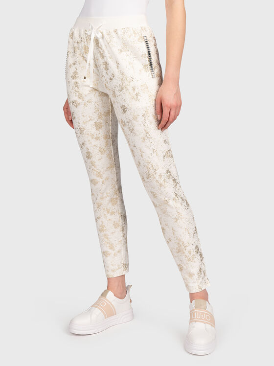 Sports trousers with shiny accents - 1