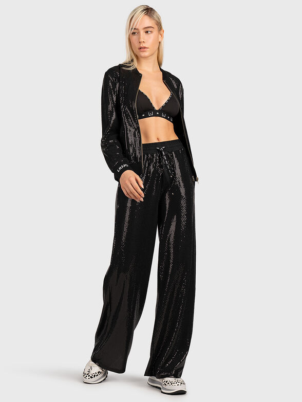 Trousers with appliquéd shiny details - 4