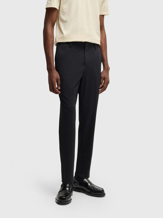 Textured trousers in beige - 1
