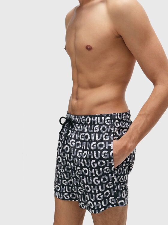 TORTUGA beach shorts with a monogram print - 1