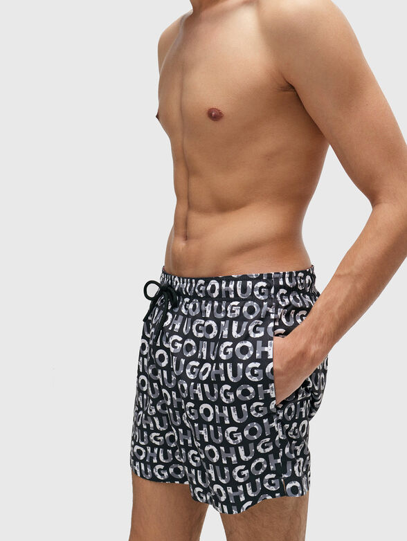 TORTUGA beach shorts with a monogram print - 1