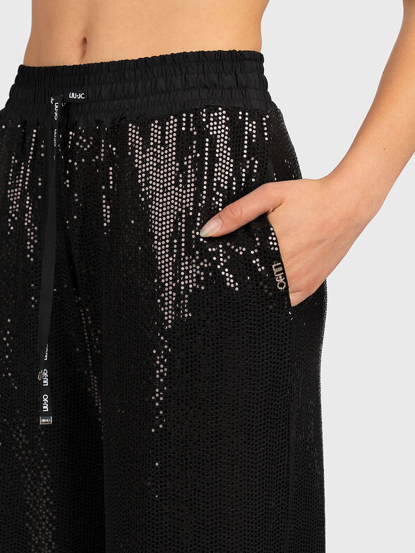 Trousers with appliquéd shiny details - 3