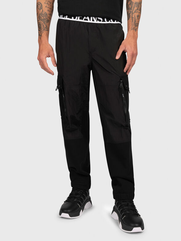 Black track pants with logo detail - 1
