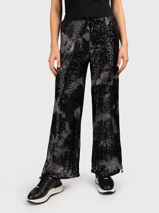 Pants with appliquéd sequins - 1