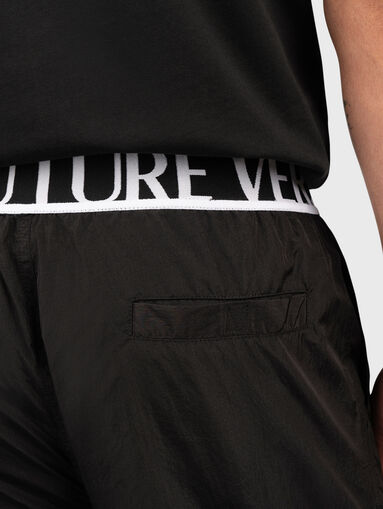 Black track pants with logo detail - 3